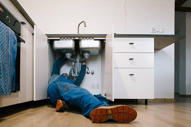 Professional Drain Cleaning technician working in Harvey, ND